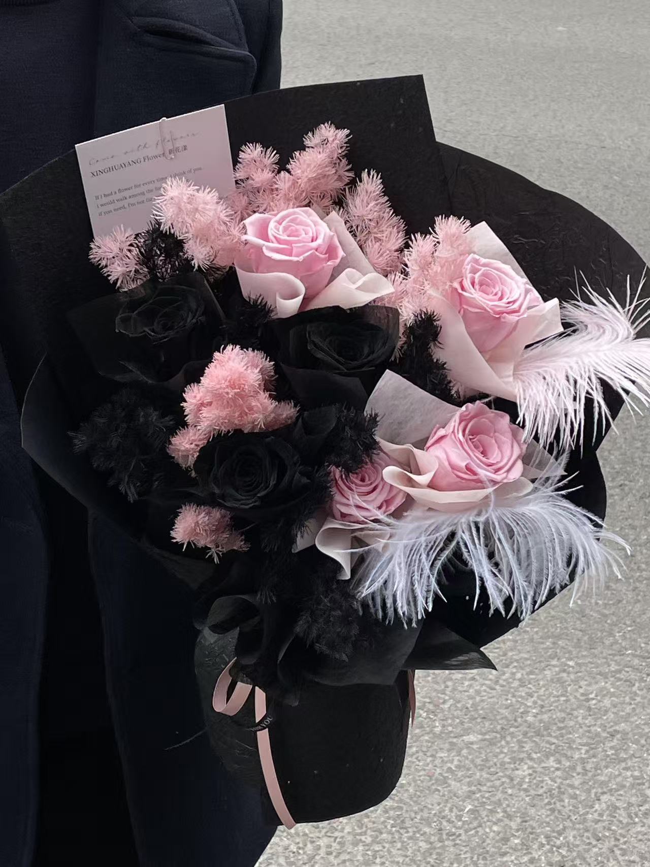 Enchanted Midnight Bloom: Pink & Black Everlasting Rose Arrangement with Feathers