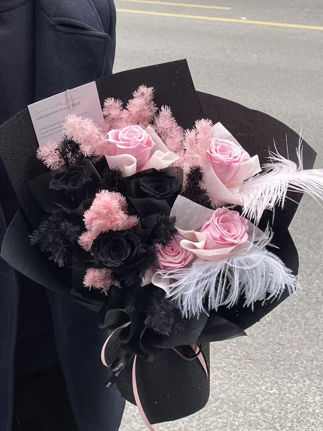 Enchanted Midnight Bloom: Pink & Black Everlasting Rose Arrangement with Feathers