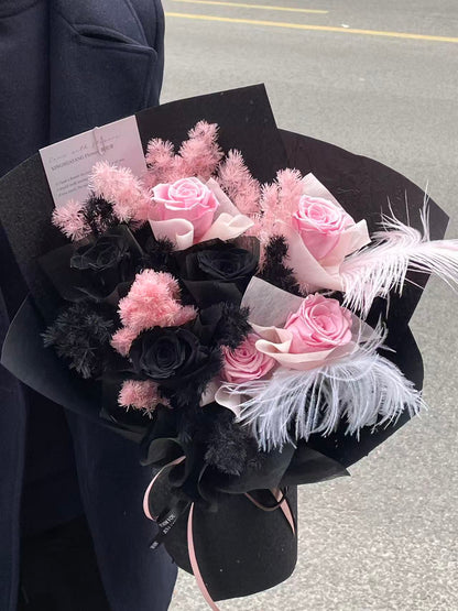 Enchanted Midnight Bloom: Pink & Black Everlasting Rose Arrangement with Feathers