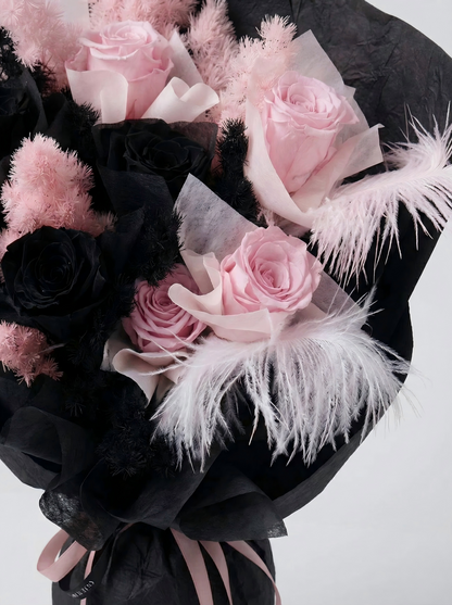 Enchanted Midnight Bloom: Pink & Black Everlasting Rose Arrangement with Feathers